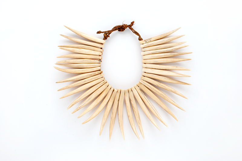 Necklace (waseisei) formed of 34 tusks carved from whale teeth, pierced and the top and strung on a cord.