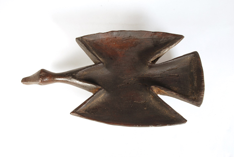 Duck-shaped dish from a solid piece of dark wood, with clear triangular design elements.