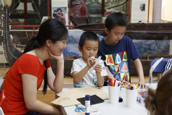 A family participate in a craft activity