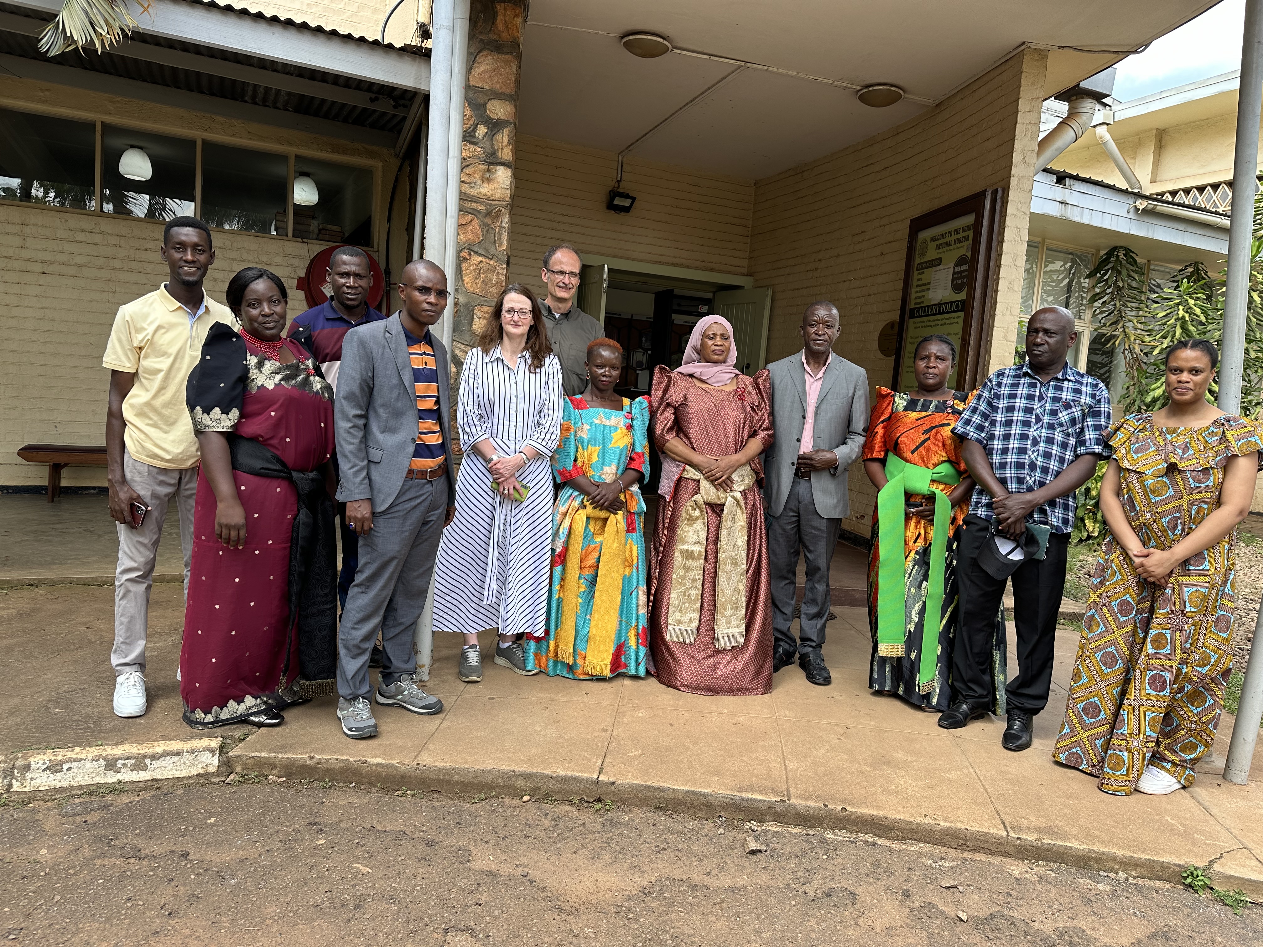 Staff from the Uganda Museum, MAA, the University of Michigan and the Wamala Tombs stand outside the Uganda Museum