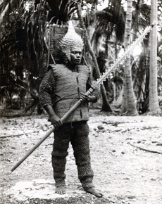 A black and white photo of a man wearing armour from Kiribati