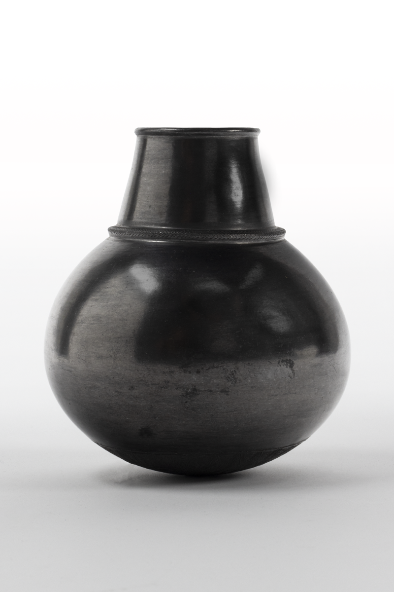 A pot with a narrow, everted rim, a tapering neck, globular body and rounded base. The outer body of the vessel has a reflective, dark grey glaze.