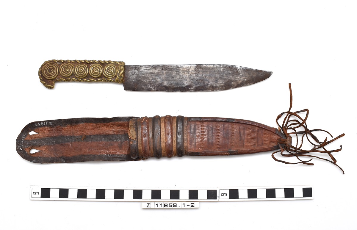 Iron knife with its leather sheath pictured below it.