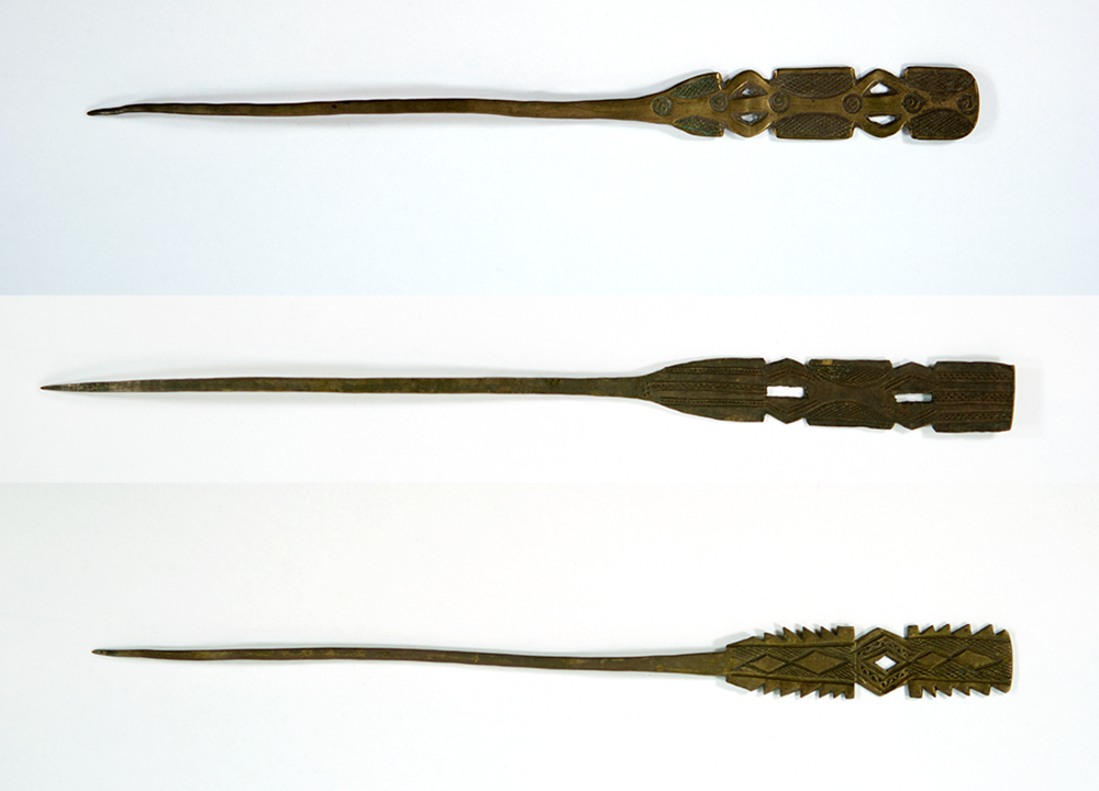 Three brass hairpins all decorated with geometric designs, with open cut outs. All dark brown brass.