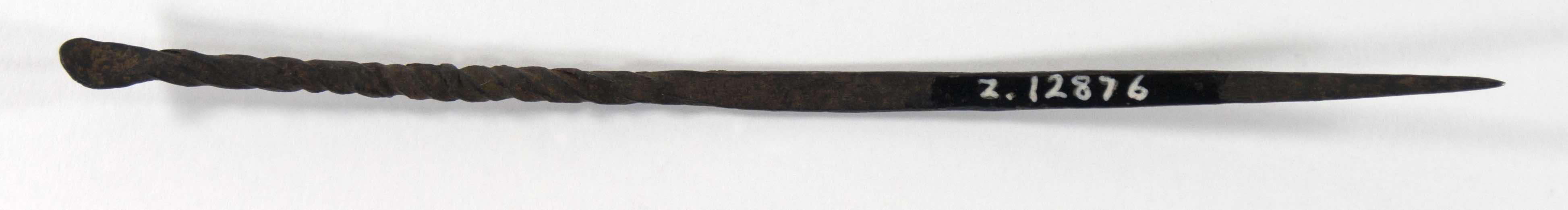 Iron hairpin formed of a long, cylindrical rod