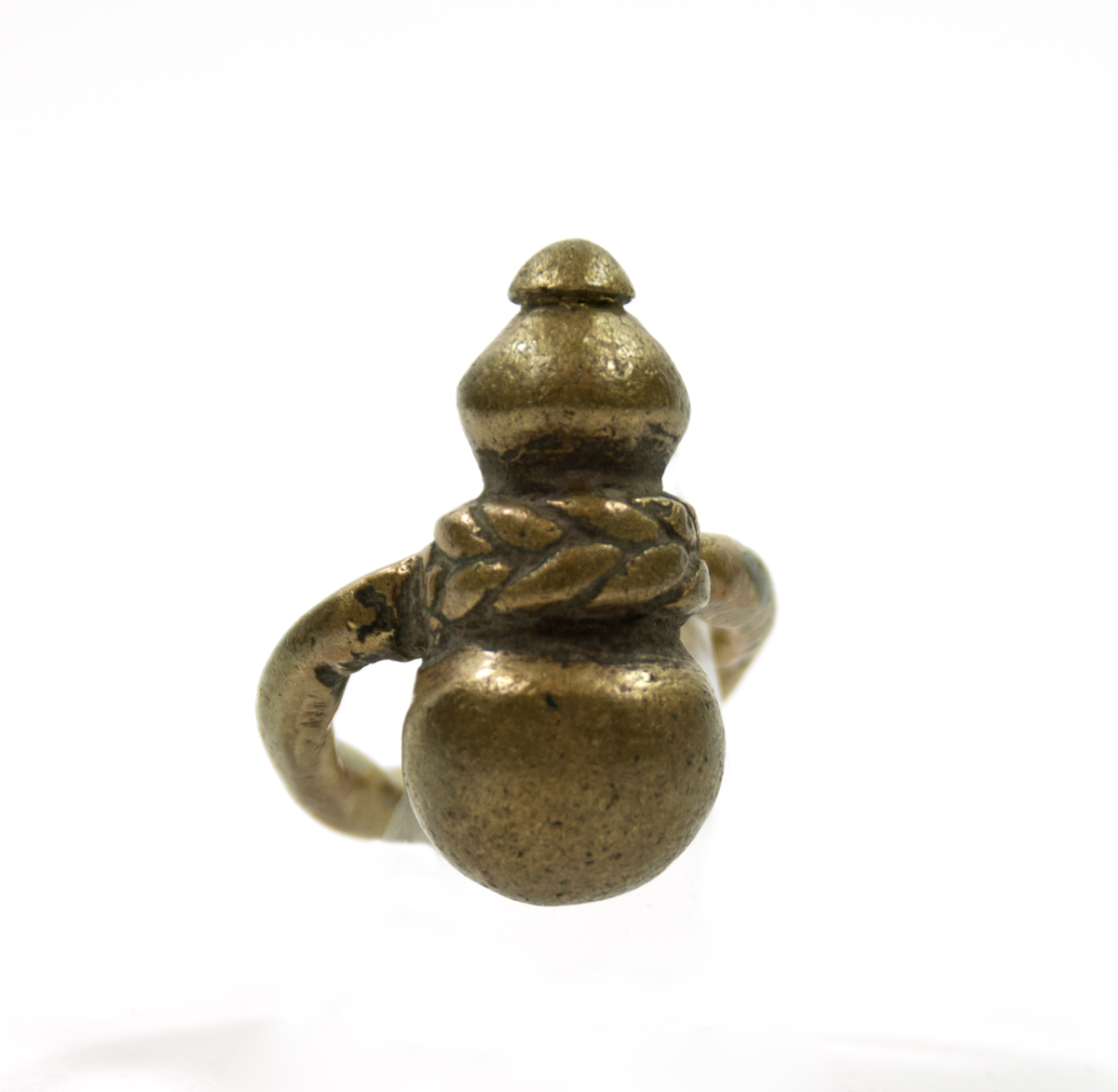 A brass ring with an ornament on the top of a calabash shape, with a plaited pattern around the middle, representing a pot for medicine.