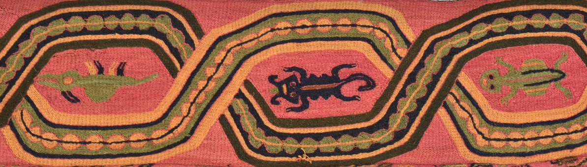  A long, mulitcoloured embroidered band with fringe from the border of a mantle. Background fabric a salmon pink, embroidered with a variety of composite animal figures, which have snake, cat, bird and lizard characteristics.