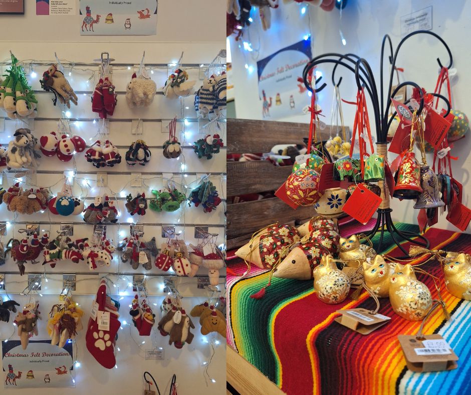 On one side are a range of felt animal decorations hanging on the wall and on the other are hand painted decorations including baubles, bells, and cand cats.