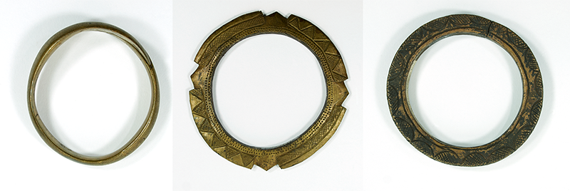 Three bracelets of wrought brass. See description for full details.