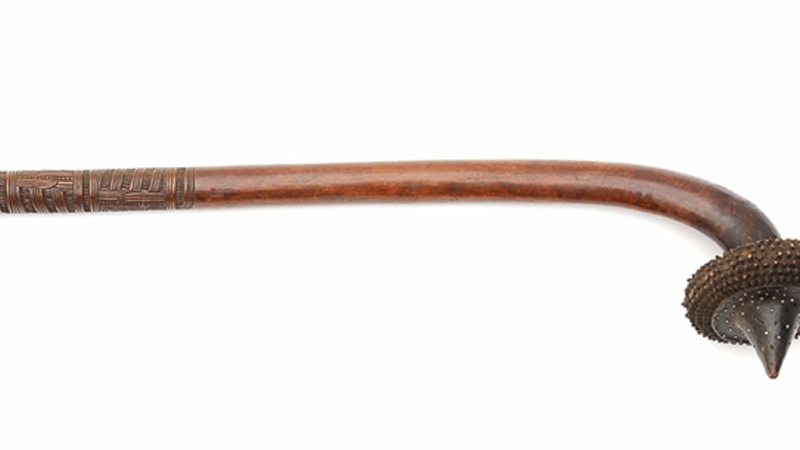 Club of dark wood, totokia ('pineapple' club). The head is circular in section and carved with 9 rows of projecting spikes (some chipped). 