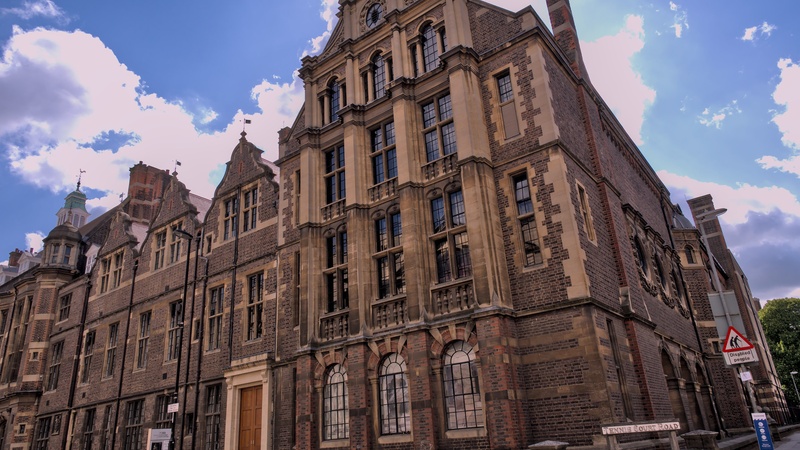 The MAA building as viewed from Downing Street from a low angle, with blue, slightly cloudy skies
