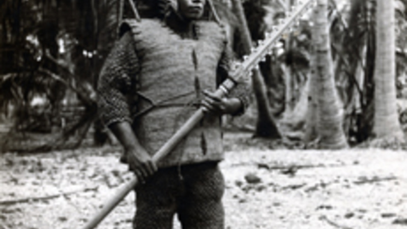 A black and white photo of a man wearing armour from Kiribati