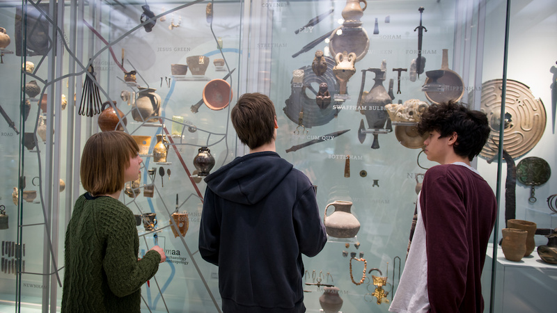 Students look at a display in the Clarke Gallery
