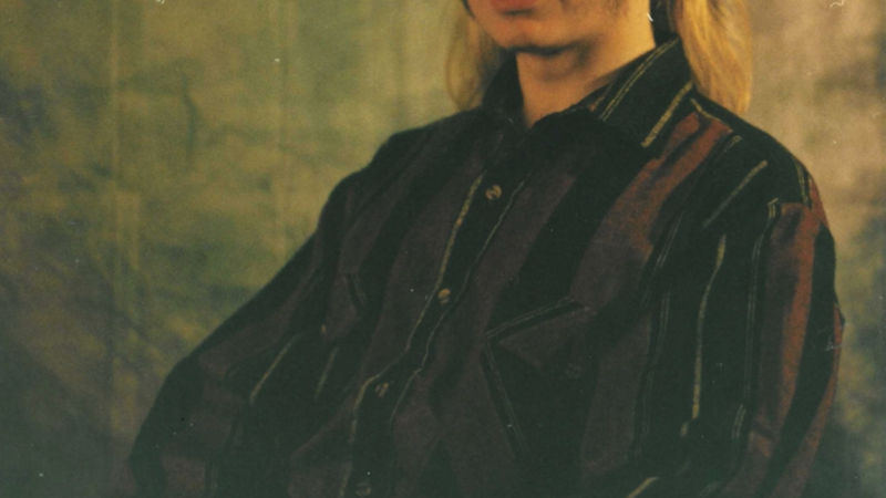 School style portrait of an Anglia Ruskin student, in melancholy deep colours.