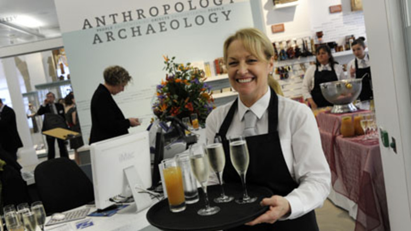 A staff member serves drinks