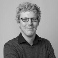 Black and white photograph of Mark Elliott, Curator of Anthropology, MAA