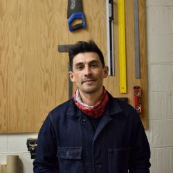 Colour photograph of Milenko Basic, Workshop Technician for the MAA Stores Move project.