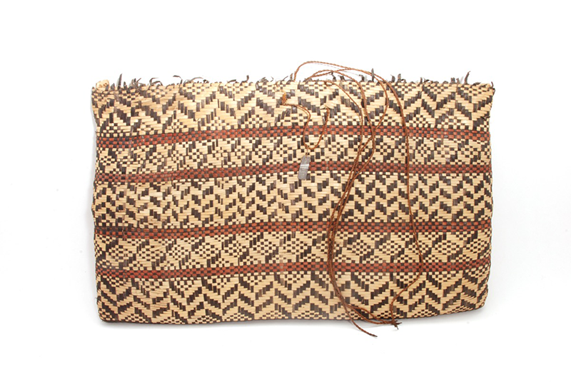 Flat satchel made from strips of natural, red and black-dyed pandanus leaf 