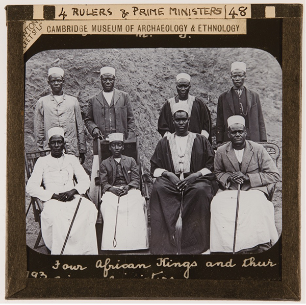 Sepia photograph with eight men, four sitting and four standing, within a paper frame. Wording: 'Rulers & Prime Ministers'. 'Cambridge Museum of Archaeology and Ethnology'