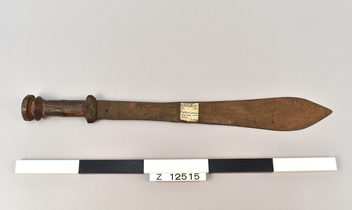 Machete with a long blade and wooden handle.