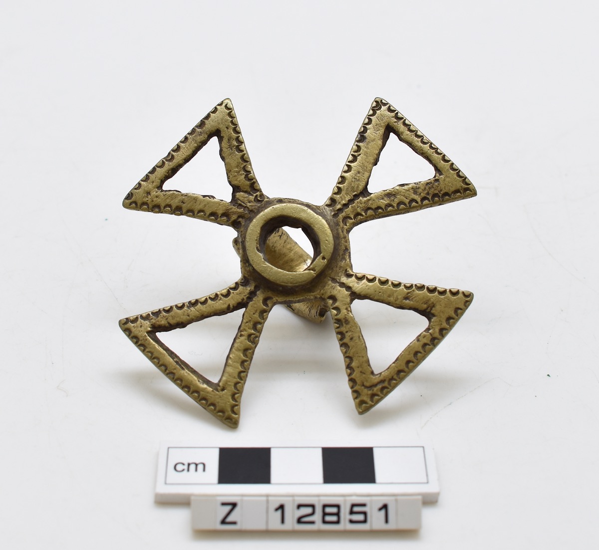 Brass ring with open work cross.