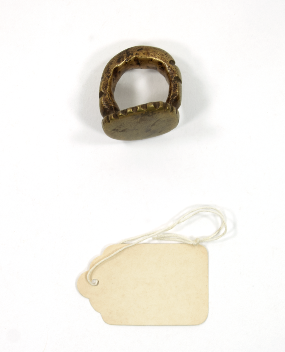 Brass finger ring in the shape of a signet ring