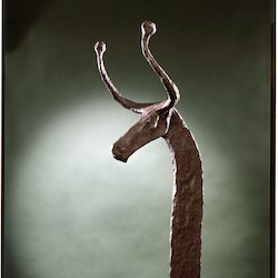 A colour photograph of an iron firedog from the Iron Age in Cambridgeshire